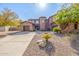 Stunning two-story home with stone accents and a three-car garage at 4543 S Roy Rogers Way, Gilbert, AZ 85297