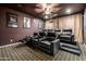 Luxurious home theater with comfortable recliner seats and movie posters at 4543 S Roy Rogers Way, Gilbert, AZ 85297