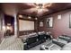 Home theater with seating for multiple viewers and a large projection screen at 4543 S Roy Rogers Way, Gilbert, AZ 85297