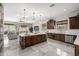 Gourmet kitchen boasts modern cabinetry, expansive island, and high-end appliances at 4543 S Roy Rogers Way, Gilbert, AZ 85297
