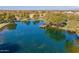 Serene lake with a wooden dock, perfect for relaxing at 4543 S Roy Rogers Way, Gilbert, AZ 85297