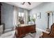 Spacious home office with a large desk and plenty of natural light at 4543 S Roy Rogers Way, Gilbert, AZ 85297