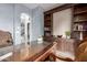 Home office with built-in shelves and a large desk at 4543 S Roy Rogers Way, Gilbert, AZ 85297