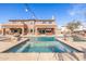 Large pool with a spacious patio and stunning backyard view at 4543 S Roy Rogers Way, Gilbert, AZ 85297