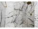 Large walk-in shower with marble tile and built-in seating at 4543 S Roy Rogers Way, Gilbert, AZ 85297