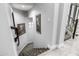 Elegant staircase with patterned carpet runner leading to the upper level at 4543 S Roy Rogers Way, Gilbert, AZ 85297