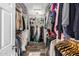 Spacious walk-in closet with ample shelving and hanging space at 4543 S Roy Rogers Way, Gilbert, AZ 85297