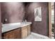 Wet bar with a quartz countertop and wooden cabinets at 4543 S Roy Rogers Way, Gilbert, AZ 85297