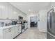 Modern kitchen with white cabinets, stainless steel appliances, and quartz countertops at 4740 E Cambridge Ave, Phoenix, AZ 85008