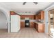 View of kitchen with wood cabinets and tiled floor at 4923 W Palm W Ln, Phoenix, AZ 85035