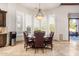 Bright breakfast nook with a round table and leather chairs, offering views of the backyard at 5330 E Sapphire Ln, Paradise Valley, AZ 85253