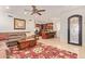 Living room with brown sofa and view of kitchen at 5330 E Sapphire Ln, Paradise Valley, AZ 85253