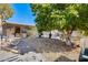 Well-maintained backyard with fruit trees and outdoor barbecue area at 5501 E Dallas St, Mesa, AZ 85205