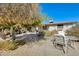 Backyard with patio area and mature landscaping, offering a private retreat at 5501 E Dallas St, Mesa, AZ 85205