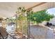 Covered backyard patio with a view of an orange tree at 5501 E Dallas St, Mesa, AZ 85205