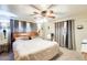 Relaxing bedroom featuring ample natural light, neutral tones, and a comfortable queen-sized bed at 5501 E Dallas St, Mesa, AZ 85205