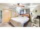 Comfortable bedroom with a ceiling fan, closet, and cozy decor creating a welcoming personal space at 5501 E Dallas St, Mesa, AZ 85205