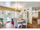Bright dining room with a chandelier and sliding door to outside at 5501 E Dallas St, Mesa, AZ 85205