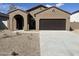 Modern stucco home with a two-car garage and neutral tones at 5644 E Orion Rd, Florence, AZ 85132