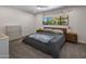 Bright bedroom with a king-size bed, dresser, and window overlooking the patio at 5820 N 83Rd St, Scottsdale, AZ 85250