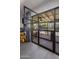 Glass doors open to a patio with pool and lush landscaping at 5820 N 83Rd St, Scottsdale, AZ 85250