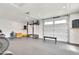 Large garage gym featuring a rack, weights, and workout machines at 5820 N 83Rd St, Scottsdale, AZ 85250
