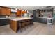 Eat-in kitchen with expansive island, double ovens, and stylish wood cabinets at 5820 N 83Rd St, Scottsdale, AZ 85250
