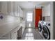 Laundry room with washer, dryer, and ample counter space at 5820 N 83Rd St, Scottsdale, AZ 85250