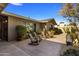 Relaxing patio area with rocking chairs, fire pit, and desert landscaping at 5820 N 83Rd St, Scottsdale, AZ 85250