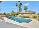 Large pool with a view of a detached workshop and lush landscaping at 5820 N 83Rd St, Scottsdale, AZ 85250