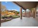 Covered patio featuring a backyard with a putting green, desert landscaping and a spiral staircase at 6102 E Sonoran Trl, Scottsdale, AZ 85266