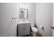 Clean, well-maintained bathroom featuring a gray vanity and modern fixtures at 6102 E Sonoran Trl, Scottsdale, AZ 85266