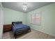 Bedroom with a bed, side table, and a window with shutters at 6102 E Sonoran Trl, Scottsdale, AZ 85266
