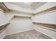 Spacious walk-in closet with built-in shelving and ample storage space at 6102 E Sonoran Trl, Scottsdale, AZ 85266
