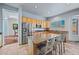 Well-lit kitchen features stainless appliances, granite countertops, and a convenient center island with seating at 6102 E Sonoran Trl, Scottsdale, AZ 85266