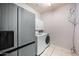 Functional laundry area with modern appliances and ample storage space at 6102 E Sonoran Trl, Scottsdale, AZ 85266