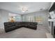 Open living area with large windows, fireplace, and access to the kitchen at 6102 E Sonoran Trl, Scottsdale, AZ 85266