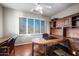 Bright office with custom built-ins, wood floors, plantation shutters, and beautiful mountain views at 6102 E Sonoran Trl, Scottsdale, AZ 85266