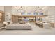 Open concept living space with a fireplace, kitchen island, and access to the backyard at 6109 E Maverick Rd, Paradise Valley, AZ 85253
