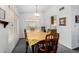 Charming dining room with a wood table and chairs, overlooking the backyard at 6921 W Columbine Dr, Peoria, AZ 85381