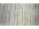 Light gray wood-look vinyl plank flooring at 7750 E Broadway Rd # 677, Mesa, AZ 85208