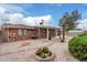 Well-maintained backyard with patio, desert landscaping, and lush greenery for an inviting outdoor space at 7950 E Lakeview Ave, Mesa, AZ 85209