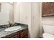 This bathroom features a mosaic tile countertop, updated sink, and a classic wooden vanity at 7950 E Lakeview Ave, Mesa, AZ 85209