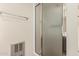 This bathroom features a shower with sliding glass doors and white tile surround at 7950 E Lakeview Ave, Mesa, AZ 85209