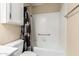 This bathroom features a shower-tub combo and neutral wall color at 7950 E Lakeview Ave, Mesa, AZ 85209