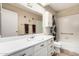 Bathroom featuring a vanity sink with a full mirror and shower-tub combo at 7950 E Lakeview Ave, Mesa, AZ 85209