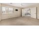 Bright bedroom featuring neutral carpet, ceiling fan, and large window with plantation shutters at 7950 E Lakeview Ave, Mesa, AZ 85209