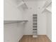 This walk-in closet features built-in shelving and ample storage space at 7950 E Lakeview Ave, Mesa, AZ 85209