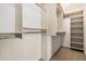 Walk-in closet with built-in shelving and hanging rods for storage at 7950 E Lakeview Ave, Mesa, AZ 85209