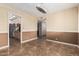 Dining area with an ornate chandelier and adjacent to the kitchen for easy access when entertaining at 7950 E Lakeview Ave, Mesa, AZ 85209